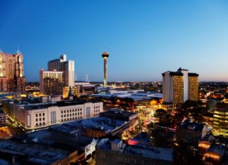Basques offer an ancestral example that provides contemporary teachings, which must be learned and remembered San Antonio downtown just after sunset showing skyline around Tower of the Americas & Alamodome