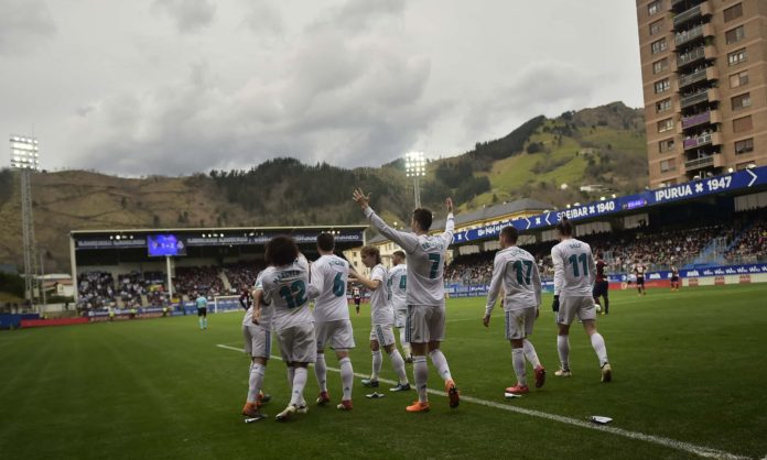 Little and large … Real Madrid’s Cristiano Ronaldo celebrating a goal against Eibar in their Ipurua stadium, in the Basque country. Photograph: Alvaro Barrientos/AP